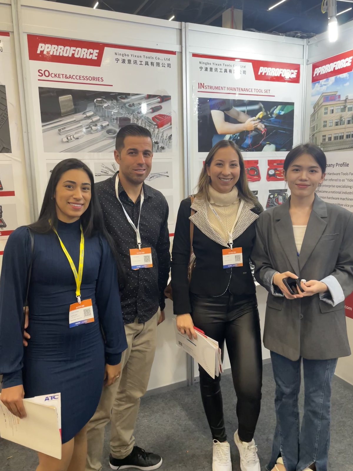 Trade show visitors reviewing PPRROFORCE tool displays