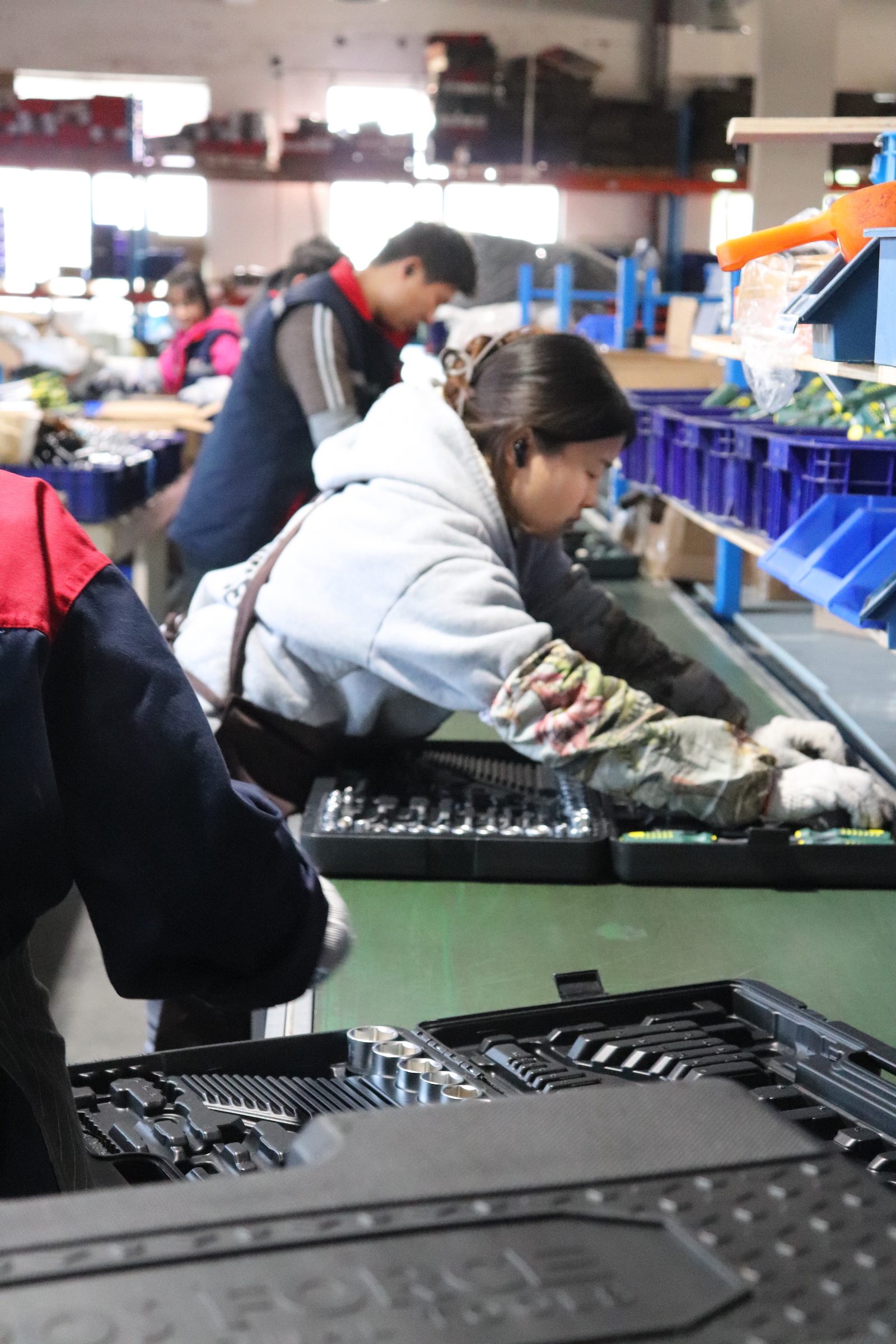 Operator assembling tool sets at a workstation